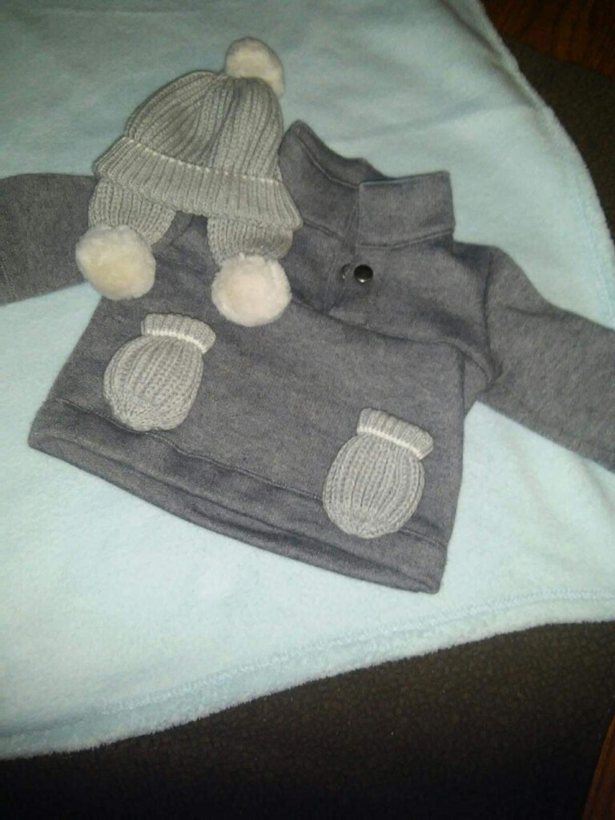 Baby Timothy, just weeks old, will wear warm hat, coat and mittens for his buggy rides to Grandma and Grandpa’s house.