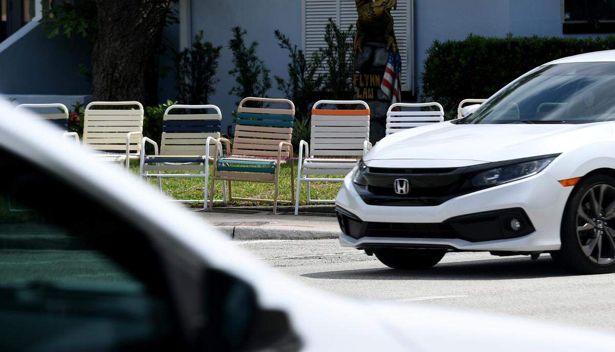 Chairs lined up along Manatee Avenue at the intersection of 32nd Street West on Friday morning.