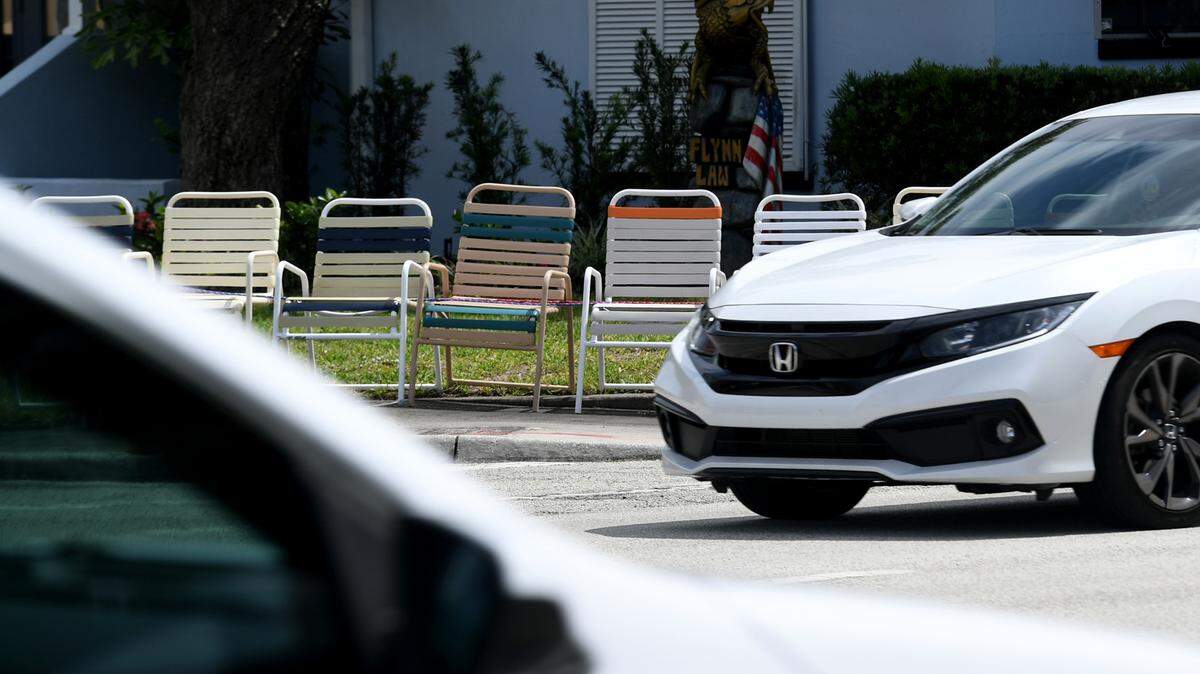 Chairs lined up along Manatee Avenue at the intersection of 32nd Street West on Friday morning.