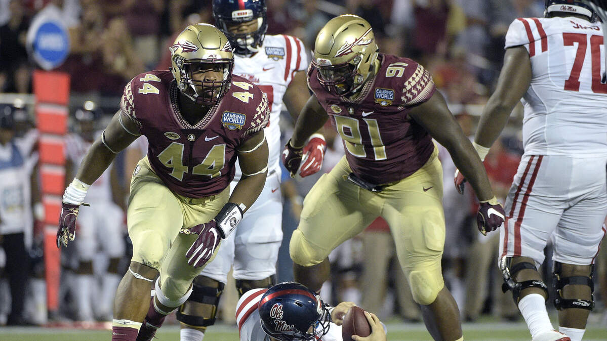 FILE - In this Sept. 5, 2016, file photo, Florida State defensive end DeMarcus Walker (44) and defensive tackle Derrick Nnadi (91) celebrate after sacking Mississippi quarterback Chad Kelly (10) during the second half of an NCAA college football game in Orlando, Fla. After not allowing 25 points or more during the regular season last year, No. 12 Florida State has allowed 30 or more in four of the past five games dating back to last year's bowl game. The Seminoles face another high-power offense on Saturday in North Carolina.