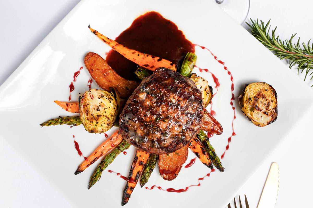 The “Montana Plate” at enRich Bistro in Bradenton is angus tenderloin prepared with a bison glaze, roasted fingerling potatoes, brussel sprouts, baby rainbow carrots and asparagus.