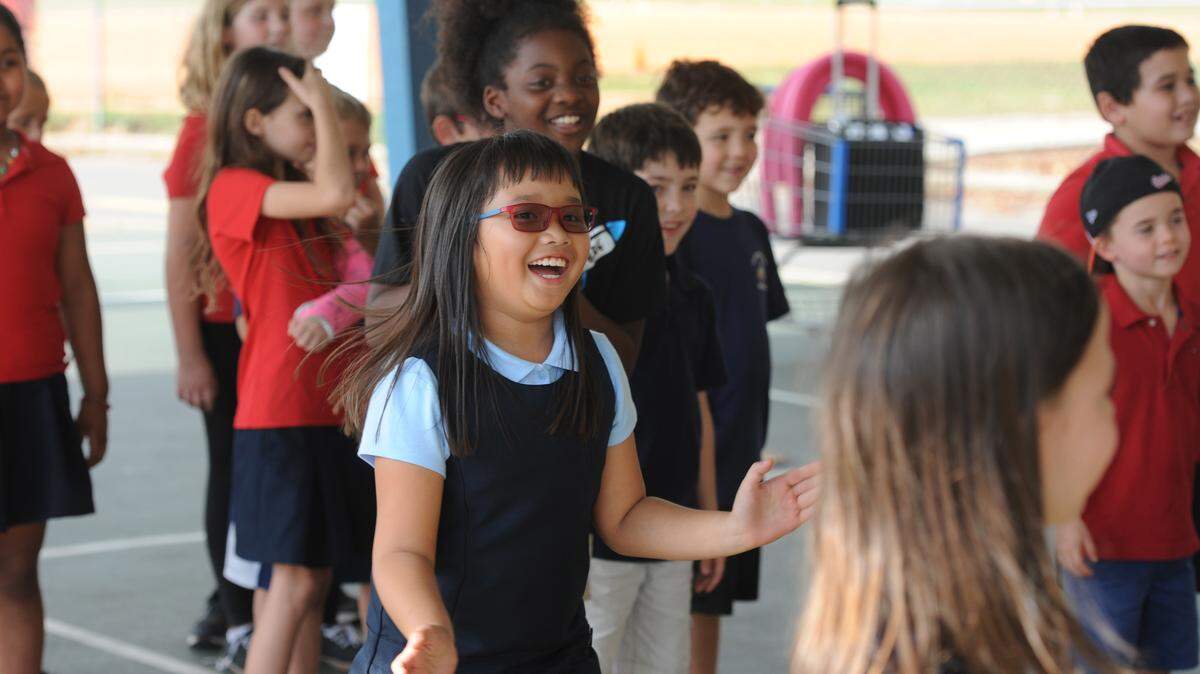 Braden River Elementary School students cheer as buckets of the green slime are dumped on their principals. The students raised over $75 each in a recent walk-a-thon and as a reward for their fundraising, got to dump buckets of the green slime on their principals. 
 GRANT JEFFERIES/Bradenton Herald