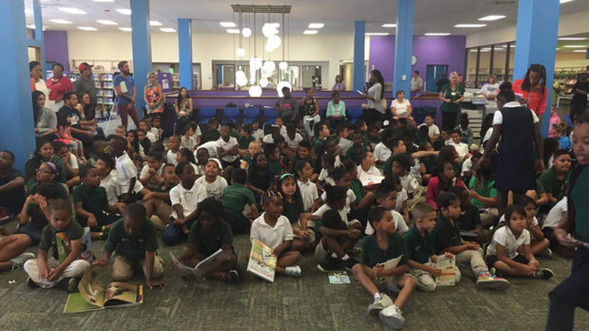In May, students at Rogers Garden Elementary School visited the library, as part of a literacy initiative. FILE PHOTO