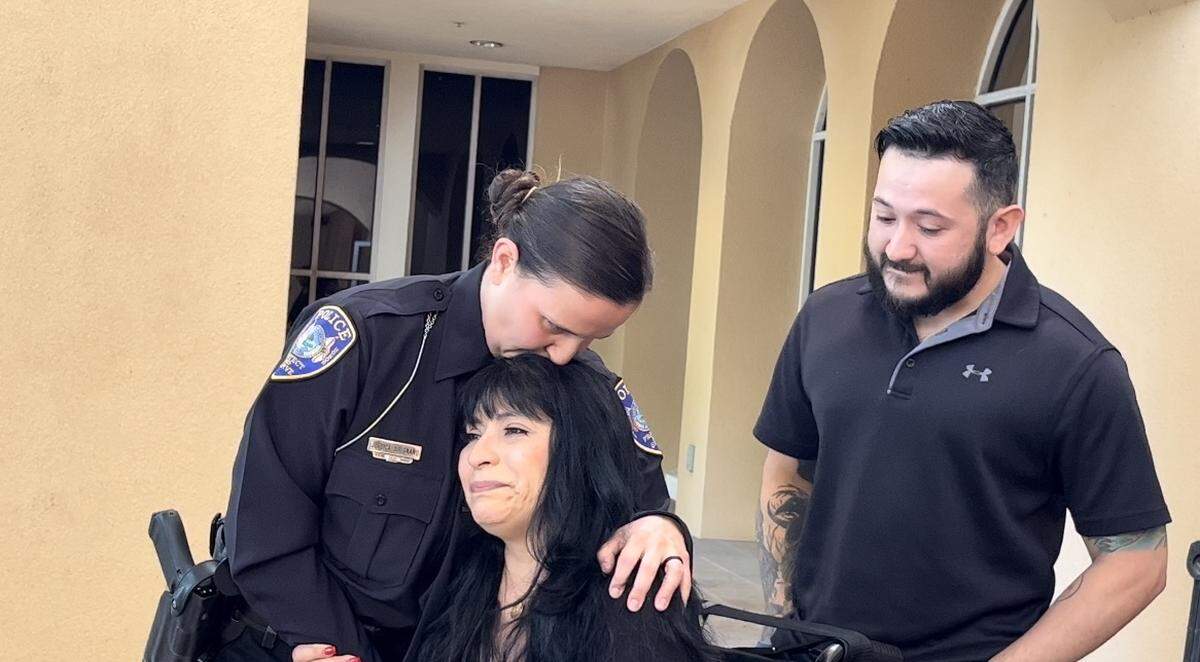 Bradenton Police Officer Jessica Sirignano presented Life Saving Award during the City Council meeting Wednesday. She leans over to kiss the top of the head of Martha Stroup who she saved after a crash on US 41 on Jan,29,2022.