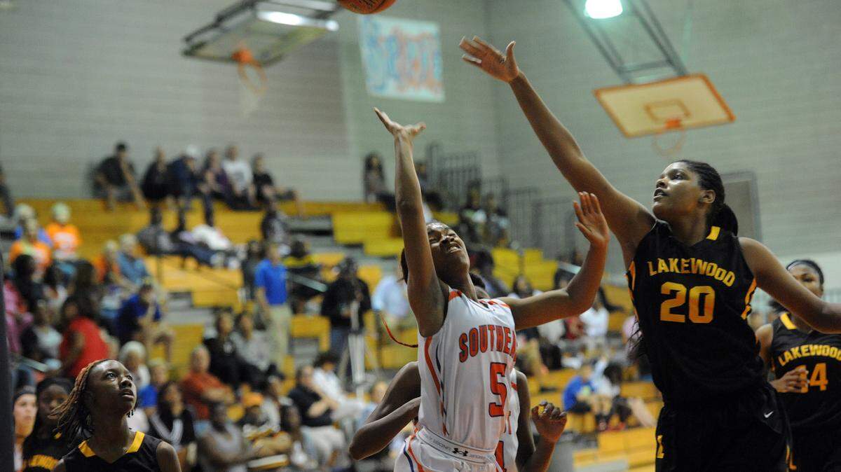 Southeast's Breyonna Reed and Lakewood's Yemiyah Morris jump for a rebound Wednesday night at Southeast's gym. 
 TIFFANY TOMPKINS-CONDIE/Bradenton Herald