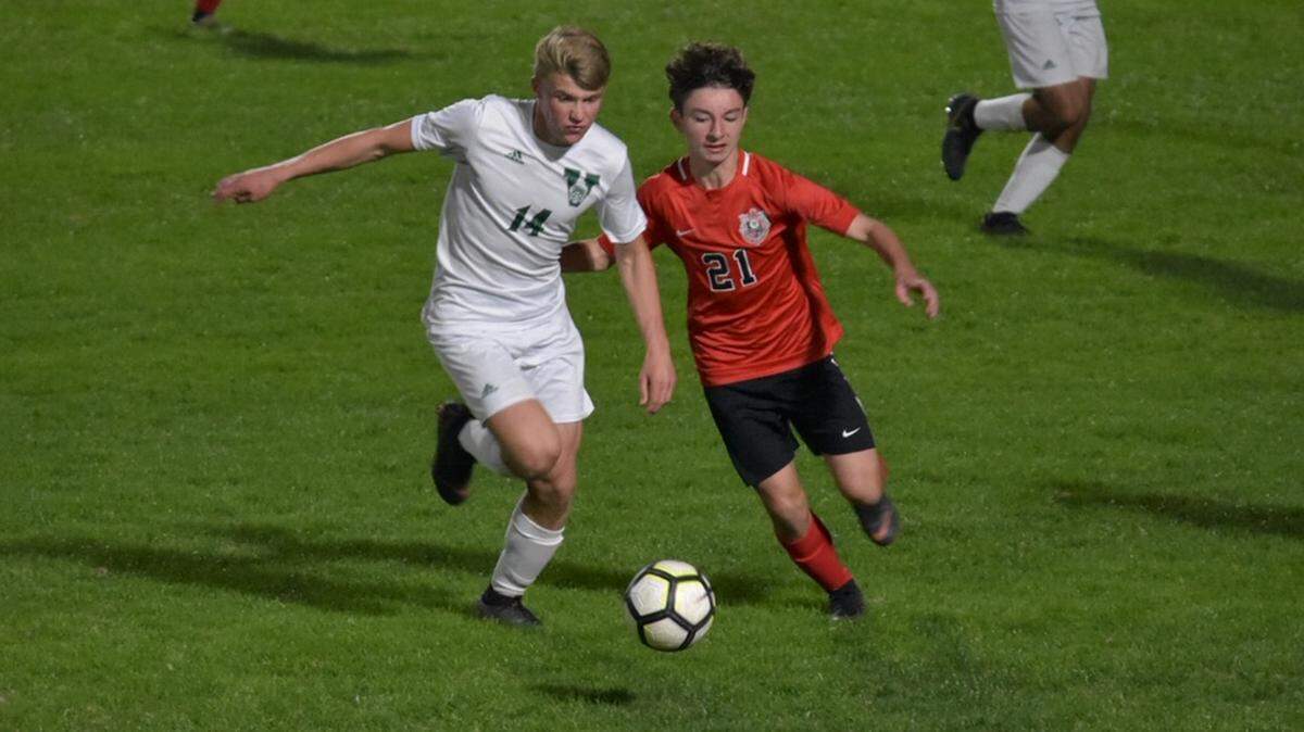 Palmetto freshman Caleb Nunamaker, right, battles for the ball during Wednesday’s game against Venice.