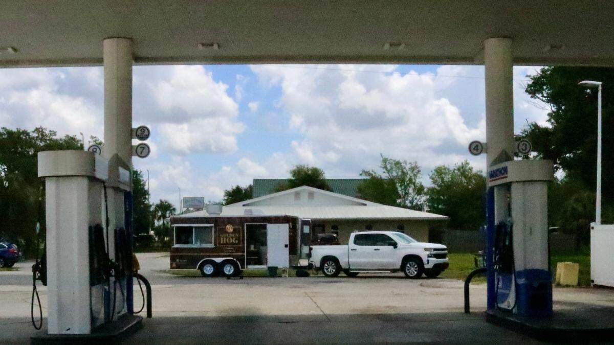 Ty Martin, owner and pit master for Ty’s Golden Hog food truck and catering, shown above May 4, 2022, serves his barbecue 11 a.m. until sold out Wednesdays and Fridays at the Marathon gas station in Parrish’s Rose Park Plaza, 8003 U.S. 301 N.
