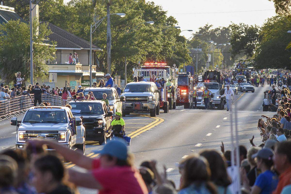 Dozens of parade cars and floats drive east on Manatee Avenue West during the 2018 DeSoto Grand Parade in Bradenton.