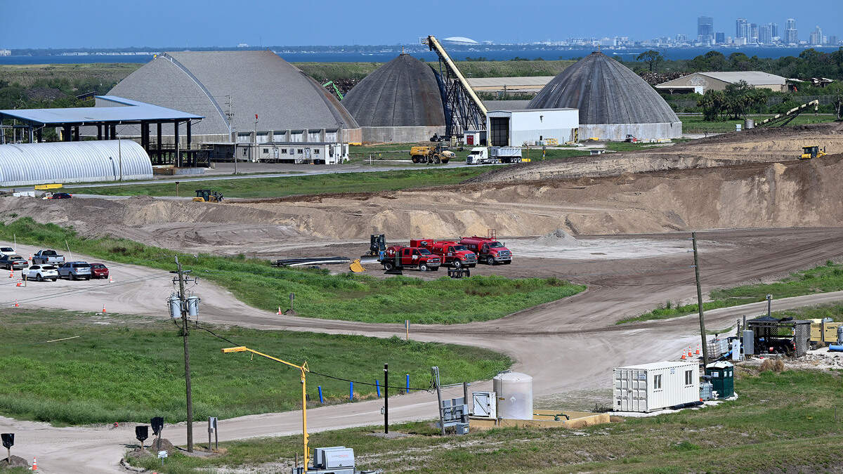 Staging areas for workers abut a massive pile of dirt used in closing the ponds. Site operators at Piney Point hope to be in the final phase of closing the former phosphate plant, shown on April 15, 2026.