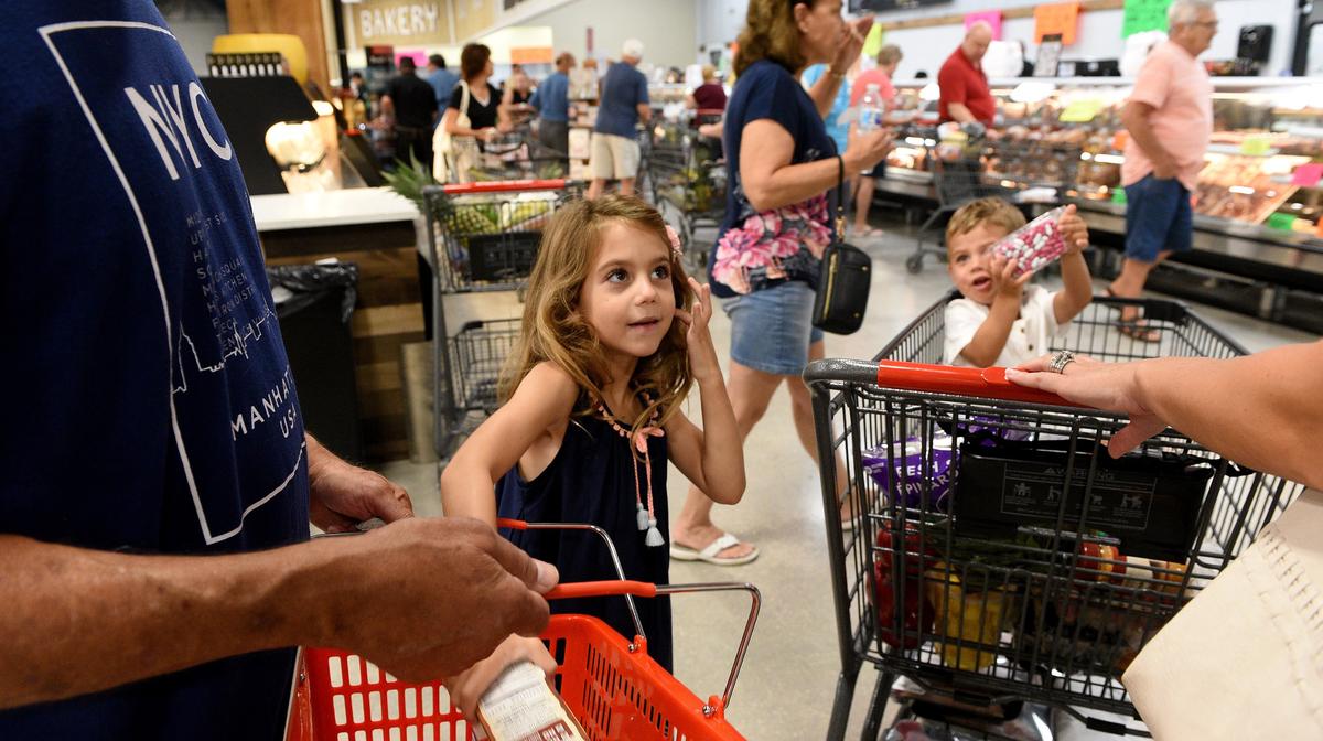 Families got into the excitement of shopping at the new Detwiler’s Farm Market in Palmetto.