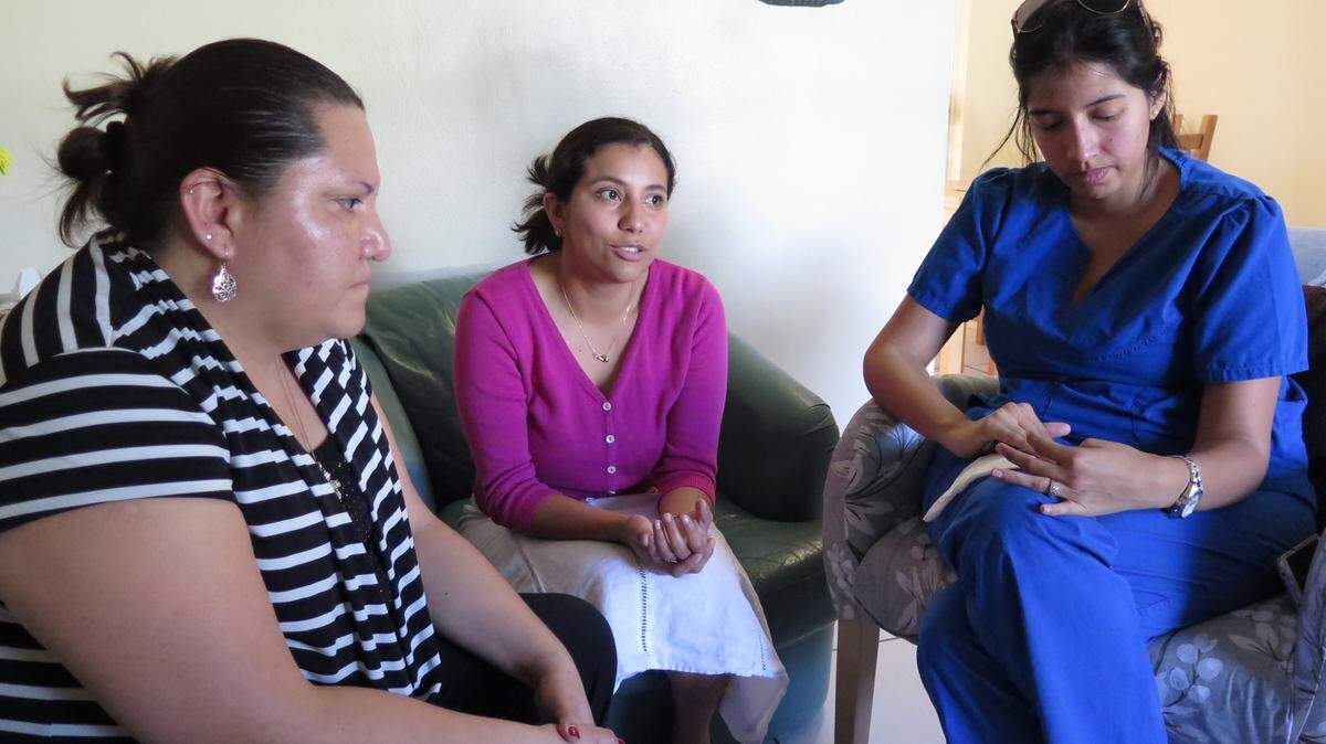From left: Rosemary Stay, 35, her sister Paola Stay-Cruz, 31, and their cousin Gisela Herrera-Pardo, 28, all of Bradenton, speak about losing their aunt Marjorie Elizabeth Macias Cruz, who was killed Saturday in the earthquake in Ecuador along with her three grandchildren. The magnitude-7.8 earthquake is reported to have killed hundreds of people and injured more than 2,000. 
 AMARIS CASTILLO/Bradenton Herald