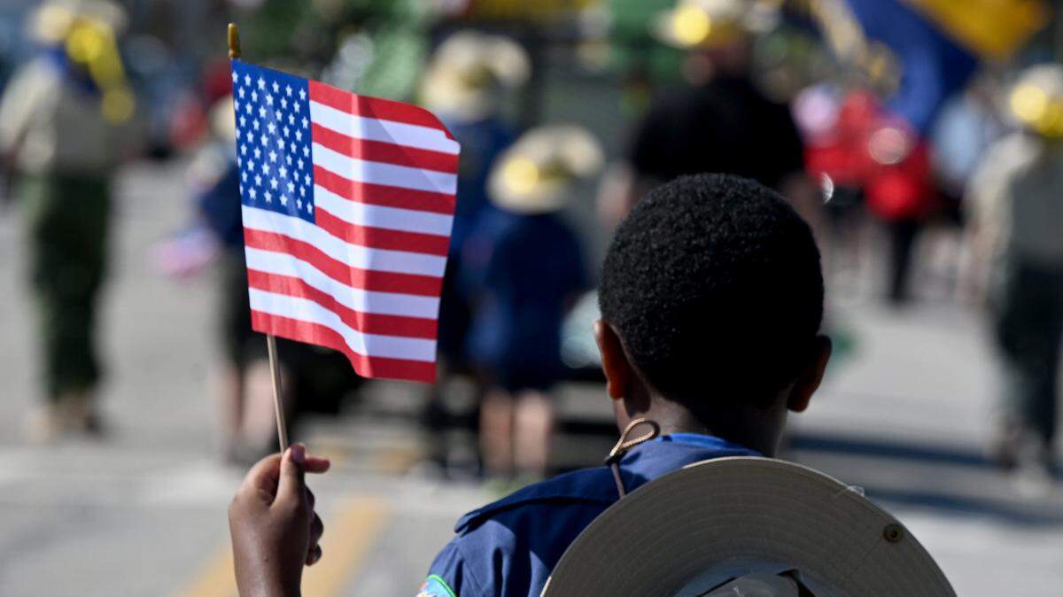 A scout from Pack 111 marches in the annual DeSoto Children’s Parade and Party in the Park in Palmetto, Fla., on April 18, 2025.