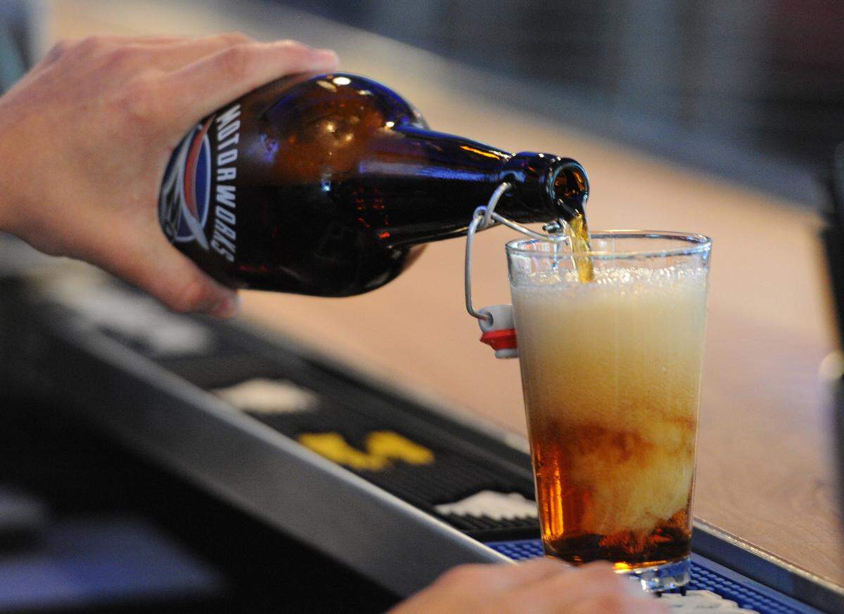 A beer is poured from a growler at Motorworks Brewing in this Bradenton Herald file photo. 
