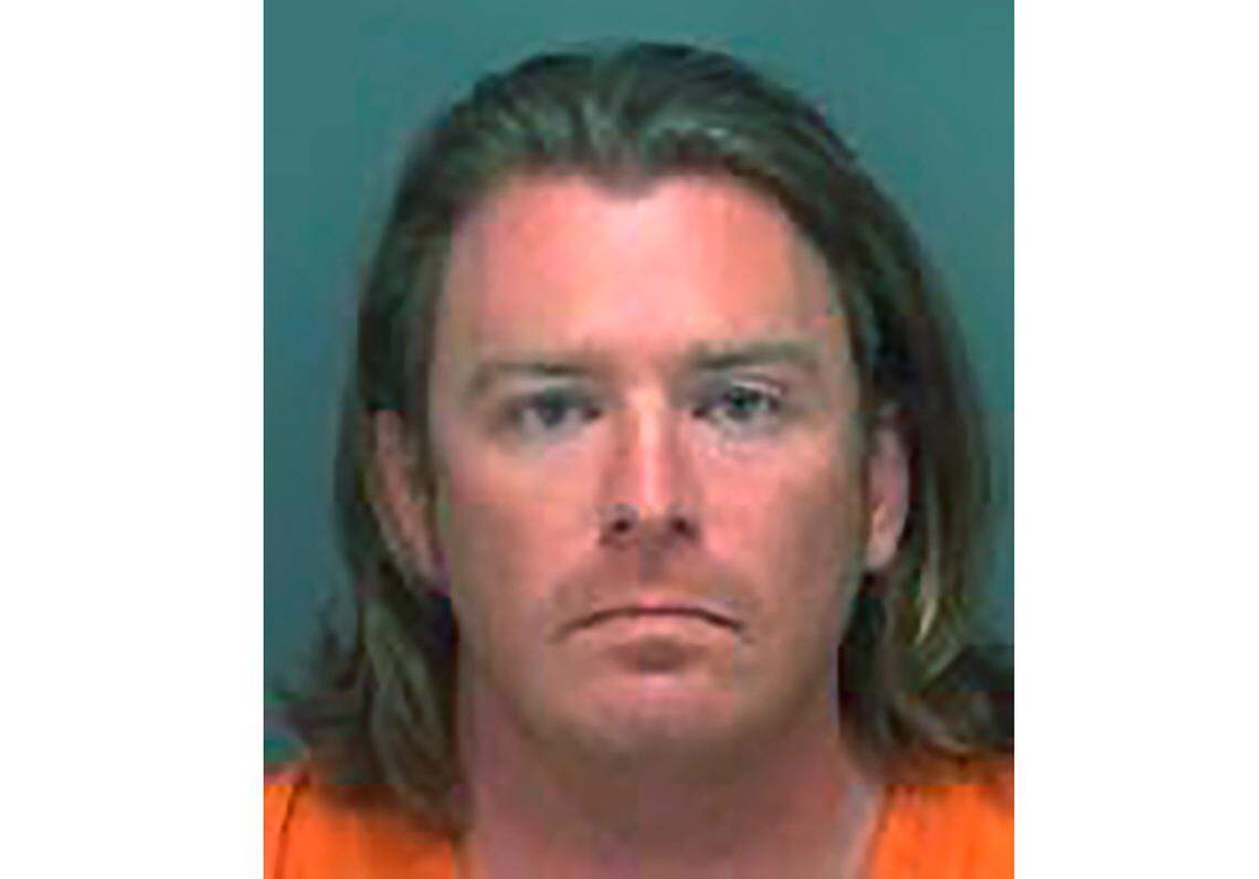 This photo made available on Jan. 8, 2020 by the Pinellas County, Fla., Sheriff’s Office shows Adam Johnson of Parrish, Fla. The Florida man was photographed carrying a lectern belonging to House Speaker Nancy Pelosi’s office at the U.S. Capitol during the Jan. 6 insurrection.