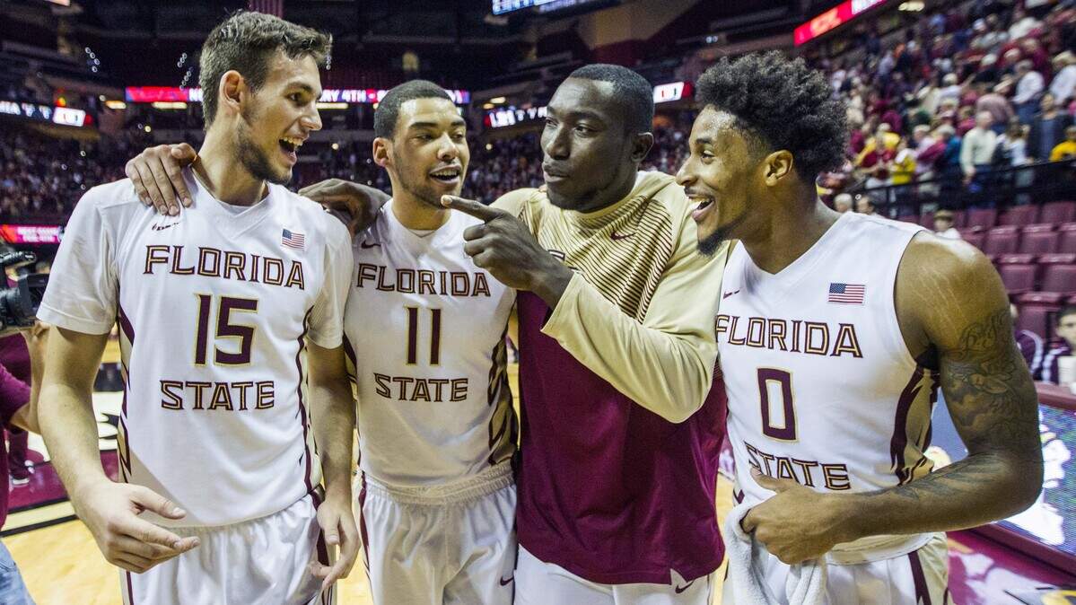 In this file photo, Florida State's Boris Bajanovsky, left, Kiel Turpin, Michael Ojo and Phil Cofer celebrate after defeating Miami 55-54 in an NCAA college basketball game, Sunday, Feb. 1, 2015, in Tallahassee, Fla.