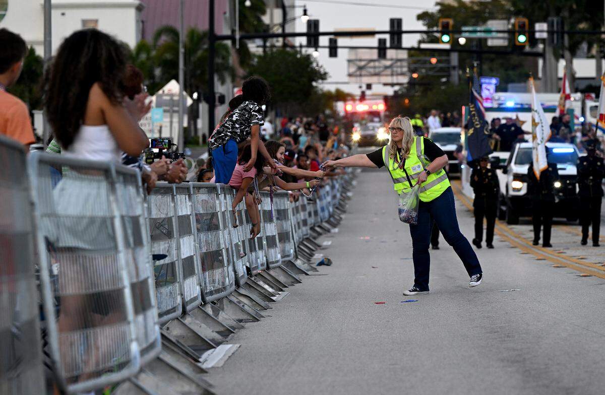 The crowd screams for beads during the DeSoto Parade on Saturday, April 27, 2024.