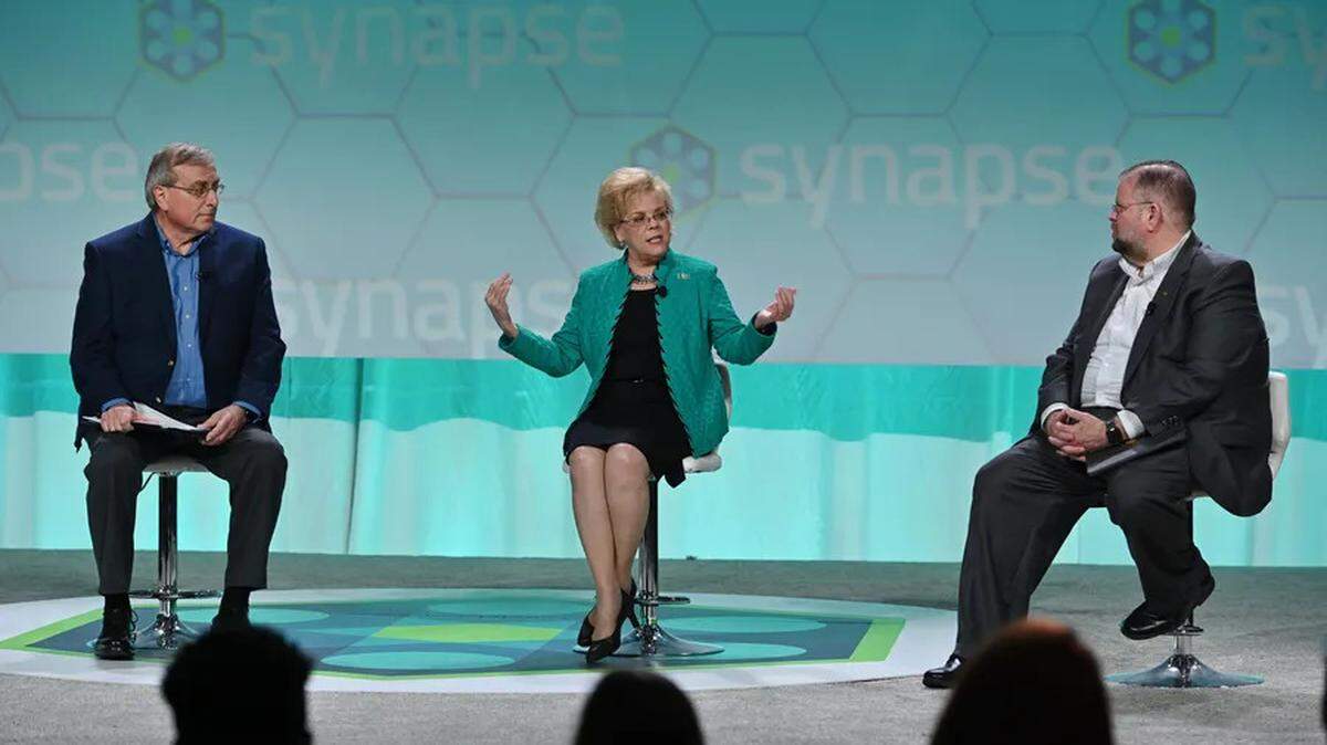 From left: University of Florida president Kent Fuchs, University of South Florida Rhea Law and University of Central Florida president Alexander Cartwright speak on a panel at the 2022 Synapse Summit at Amalie Arena on Feb. 17, 2022.