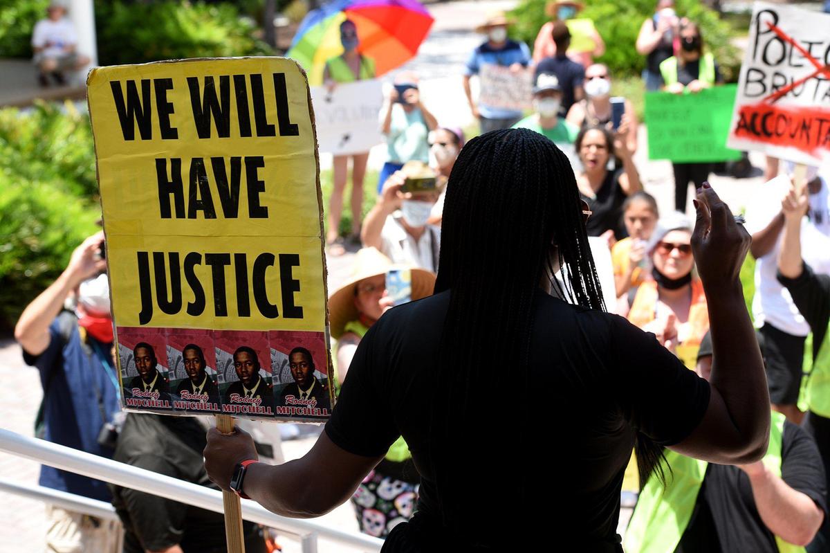 Natasha Clemons addresses a crowd at the county courthouse during a peaceful march in Bradenton.