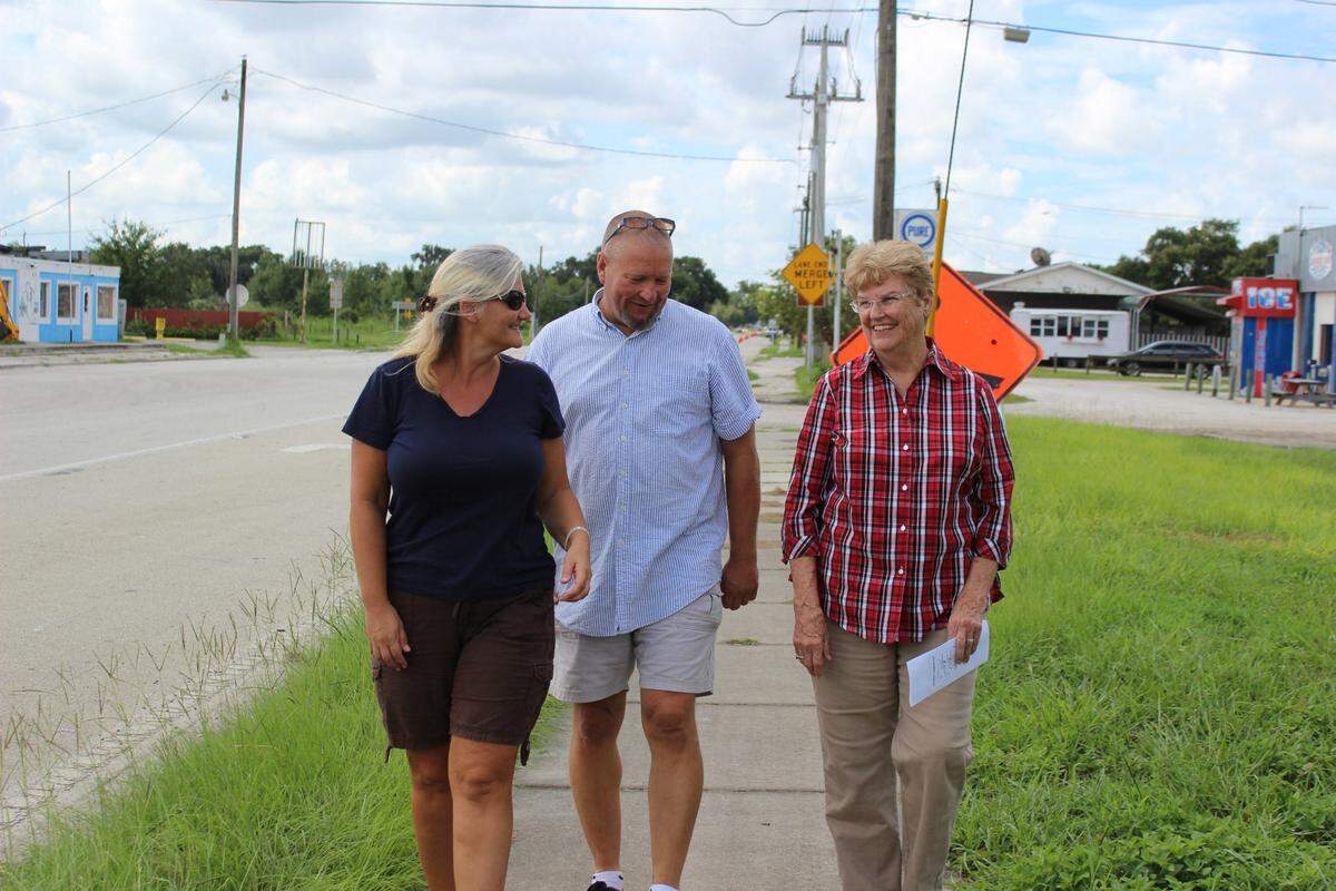 Gretchen Fowler, left, president of the Parrish Civic Association, wants to find a way to work with development to help make the 150-year-old village of Parrish become a sustainable, walkable community. Also shown are Ron Kolanowski, and Norma Kennedy.