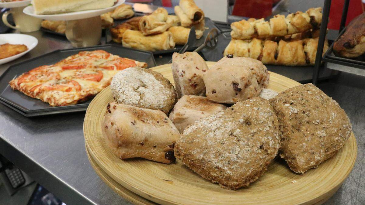 Platter presents a mix of cranberry-and-walnut rolls and multi-grain breads at Mama G’s German Bakery and Coffeehouse.