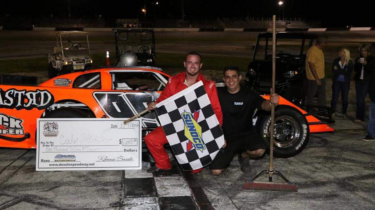 Cody Stickler poses in victory lane after winning the second 50-lap open wheel modified feature of the night at Desoto Speedway on Saturday in Bradenton. 
 PHOTO PROVIDED