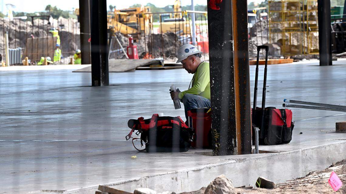 A construction worker in the new terminal under construction at Sarasota Bradenton International Airport, Sept. 25, 2023.