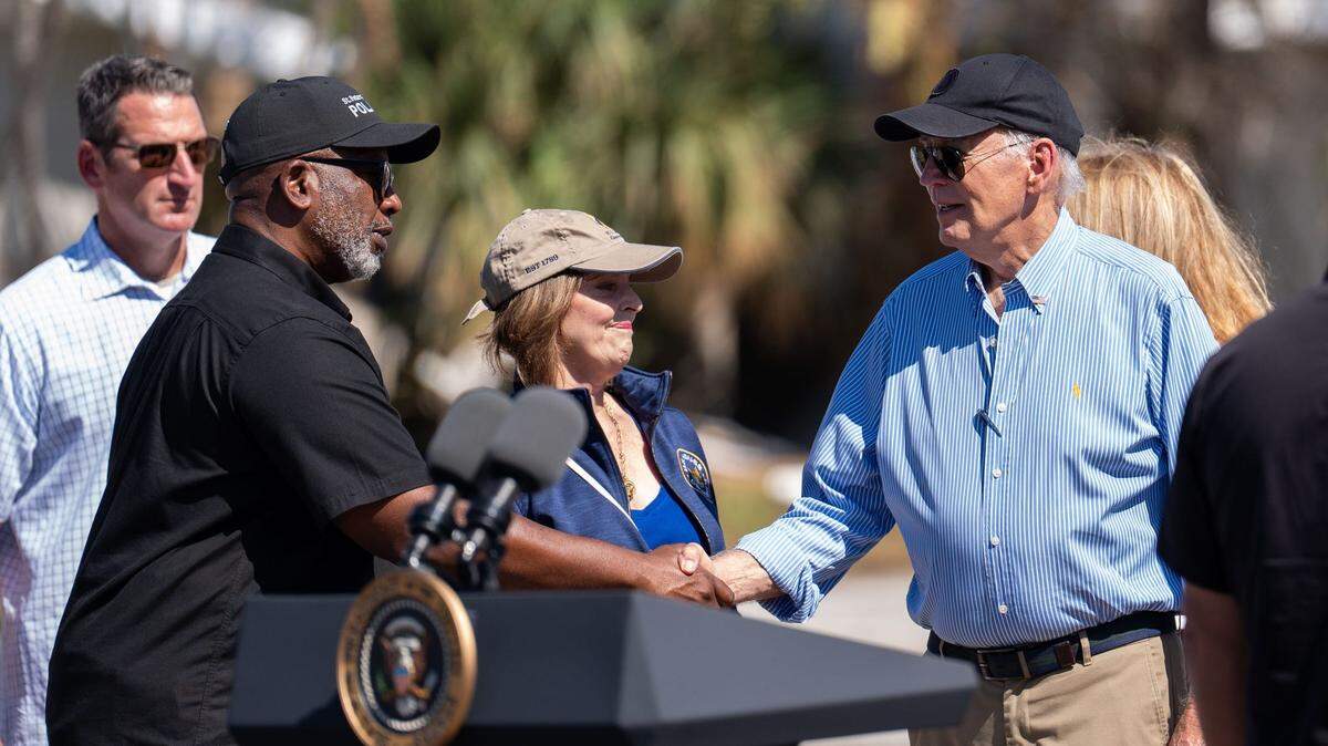 St. Pete Mayor Kenneth Welch shakes hands with President Joe Biden after a press conference held in St. Pete Beach, Florida, Sunday, Oct. 13, 2024.
