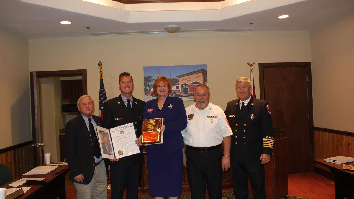 Pat Love, firefighter Mike Dunn, Amber Putman, Tony Fouse and Fire Chief Jeffrey S. Hoyle. Provided photo