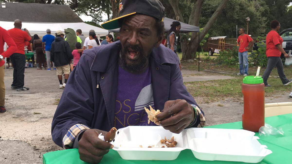 Emmanuel Sanders, who is homeless, enjoys Mt. Gilead Seventh Day Adventist Church's Community Thanksgiving Dinner at 1803 13th St. W., Bradenton on Sunday. 
 RICHARD DYMOND/Bradenton Herald