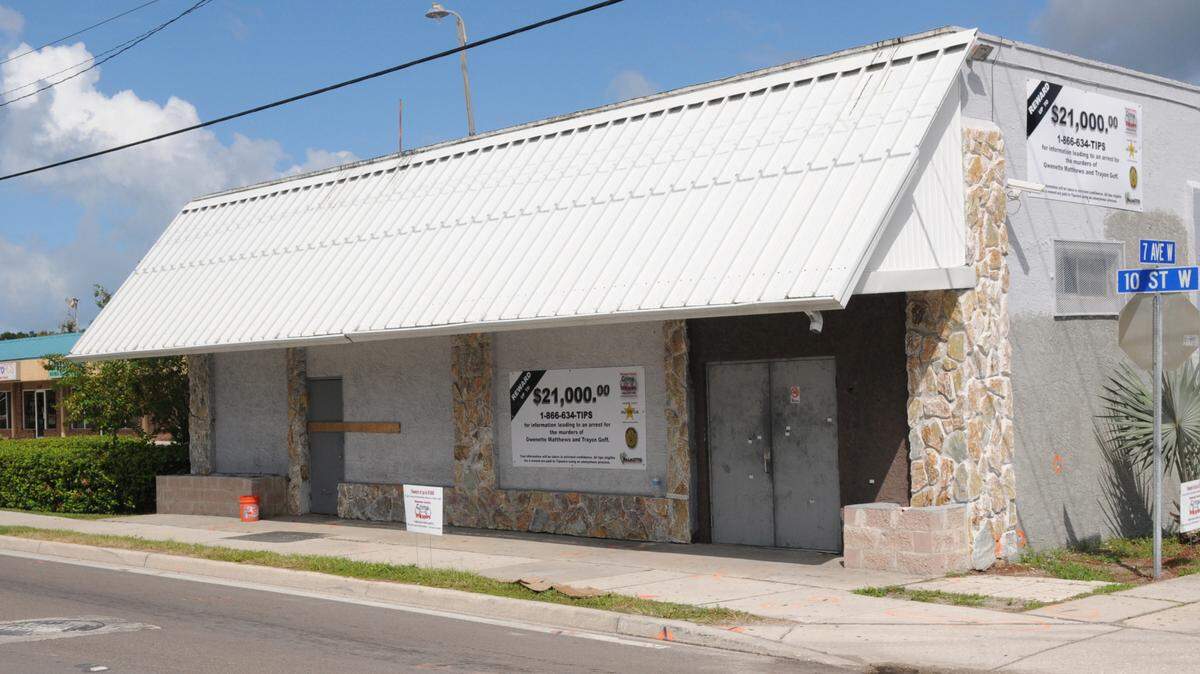 Reward signs were placed at the former Club Elite on 10th Avenue West in Palmetto, drawing attention to the $21,000 reward offered for information leading to the arrest of those involved in a shooting that killed 2 and injured 22 people on Sept. 10, 2011, in this 2011 file photograph. FILE PHOTO-GRANT JEFFERIES/Bradenton Herald