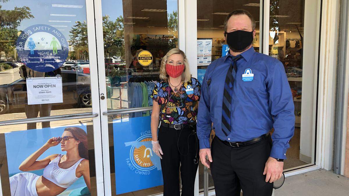 Bealls reopened its department stores on Monday. Shown above are two members of the staff at the Creekwood Crossing store.