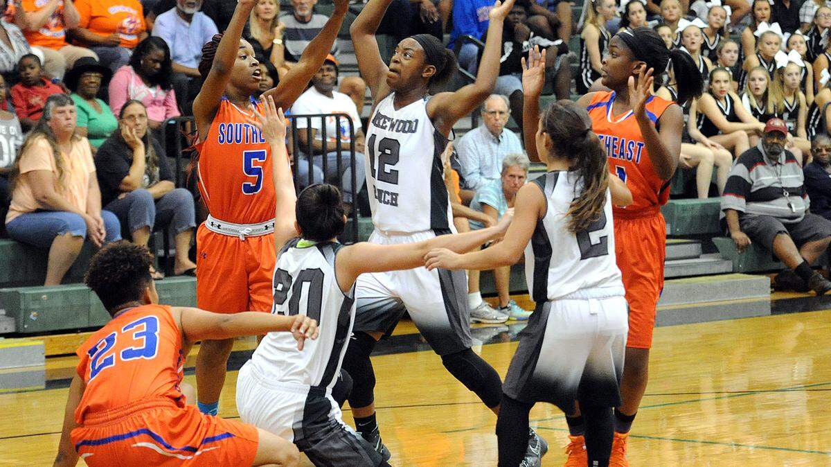 Southeast's Breyonna Reed passes as Lakewood Ranch's Aleah Robinson tries to block her Wednesday night. 
 TIFFANY TOMPKINS-CONDIE/Bradenton Herald
