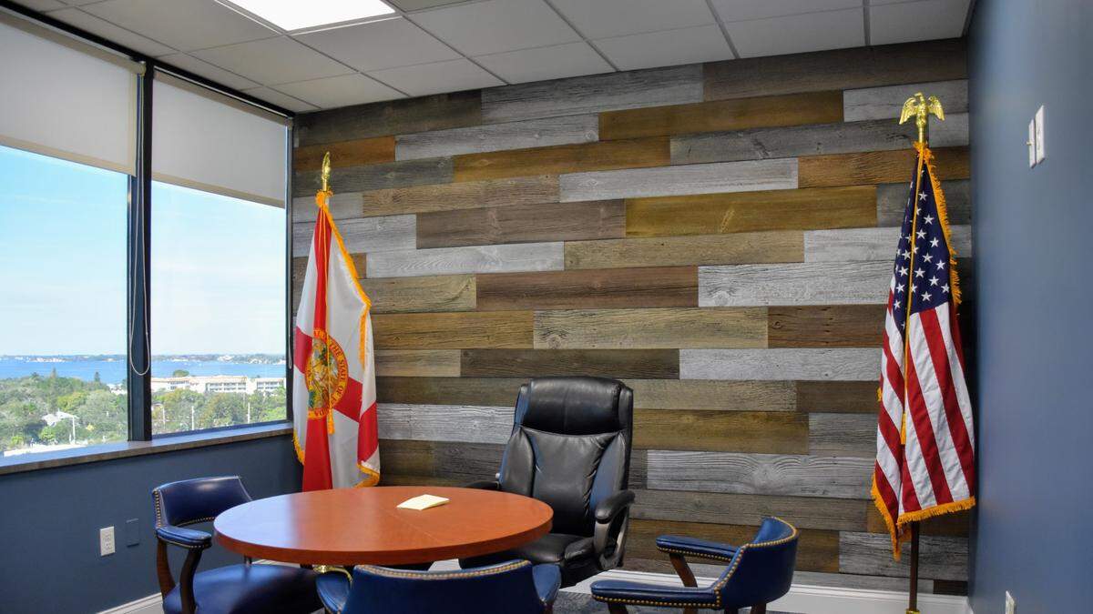 According to Manatee County government invoices, Commissioner Kevin Van Ostenbridge requested this shiplap wood accent wall in his District 3 office. Installing it cost more than $2,200, records show.
