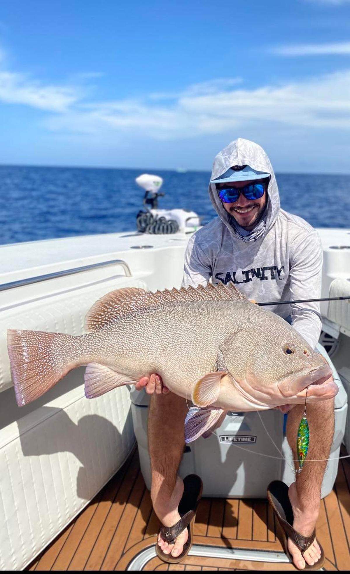 Alex Pearson shows off the Kitty Mitchell grouper he caught in 600 feet of water in April 2022.