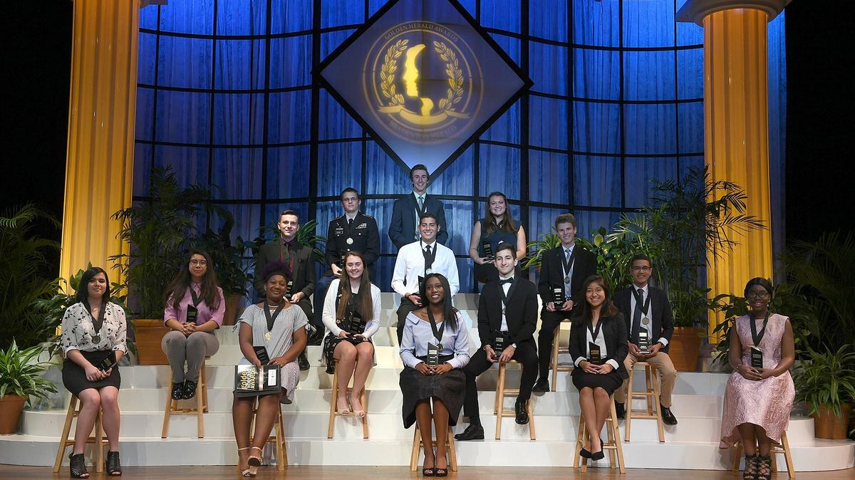 The winners of the 41st Annual Golden Herald Awards pose onstage after the evening's award ceremony at Neel Auditorium Thursday.