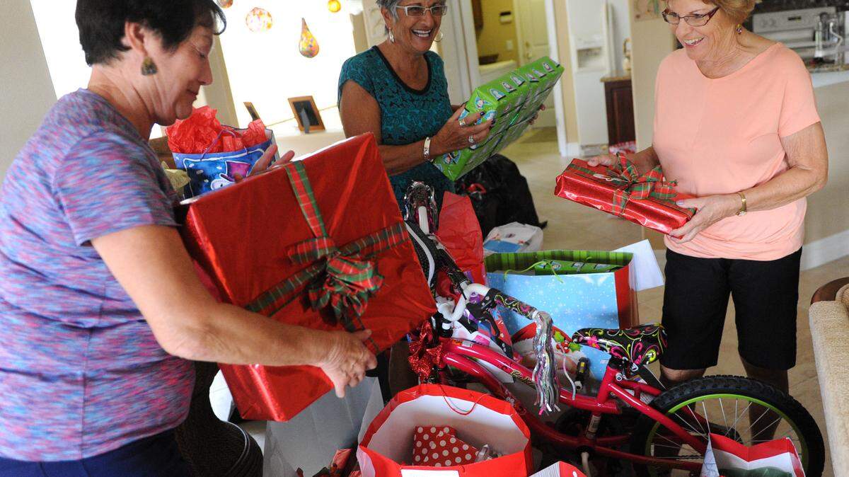 Waterlefe residents Janet Stepp, Janis Bumgarner and Linda Gratsch sort gifts donated through The Giving Tree program.GRANT JEFFERIES/Bradenton Herald