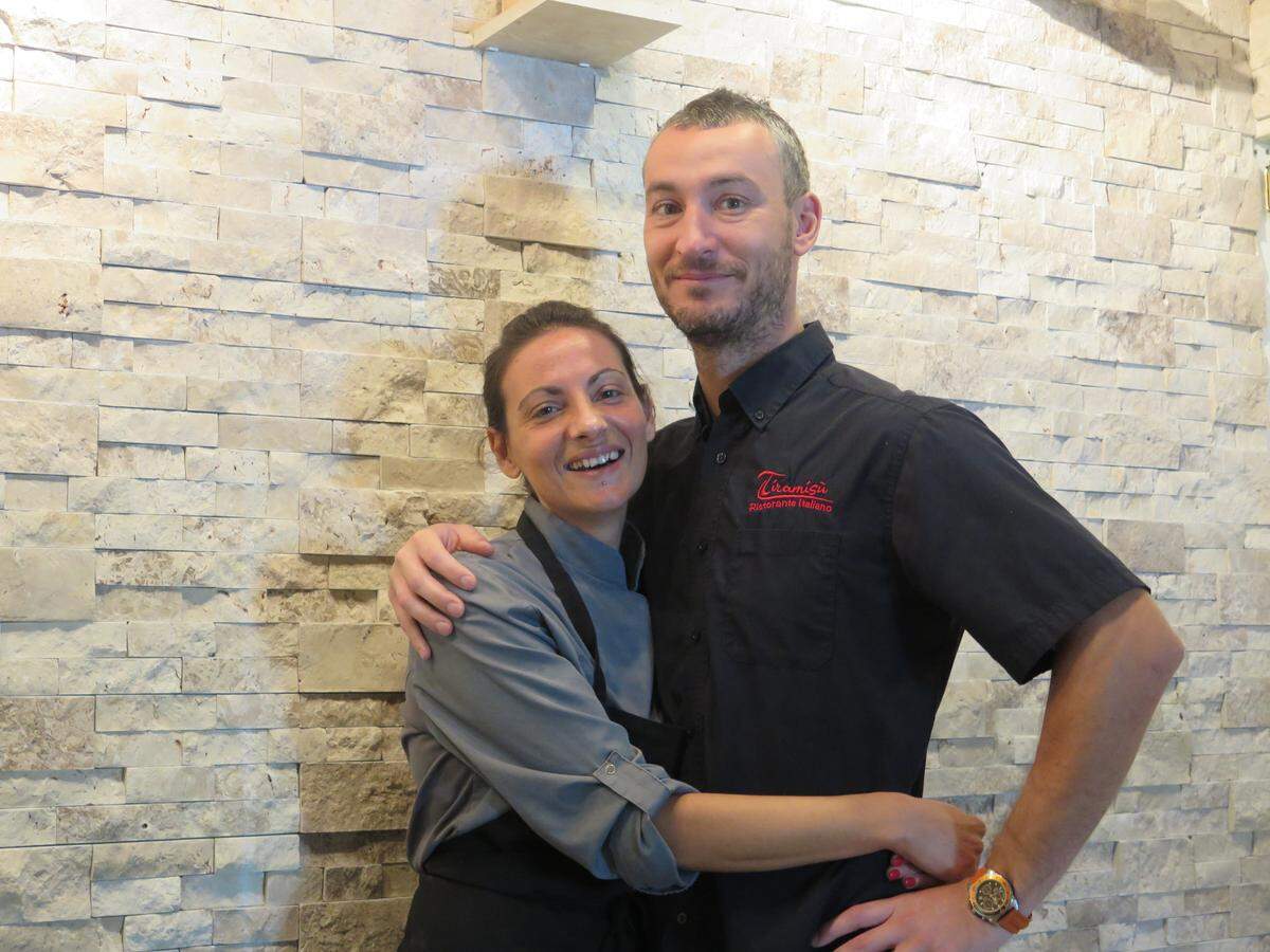 Luca (right) and Monica Cecconi pose for a photo in front of a newly renovated wall in their Tiramisu Ristorante Italiano at at 5215 14th St. W. in Bradenton. The restaurant was closed for two weeks in June for small improvements that make a big difference in the dining experience.