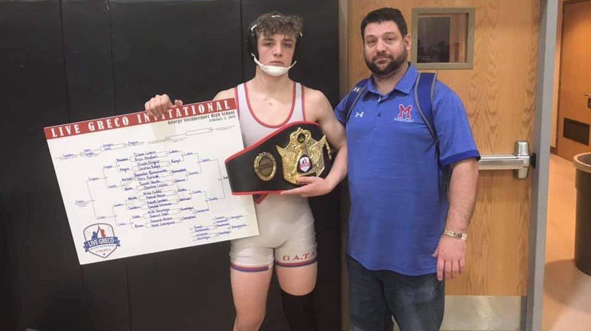 Dan Lukens, right, and sophomore Tylynn Lukens are the first father-son duo in Manatee High history to wrestle for coach Andrew Gugliemini.