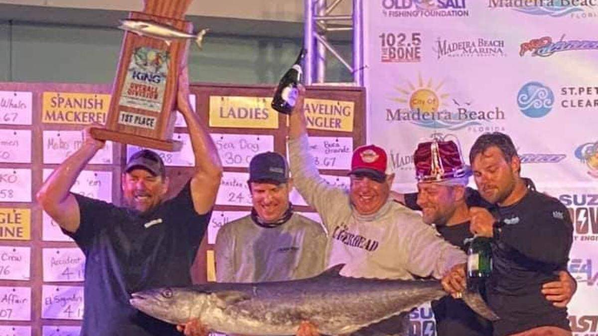 The winning team with the winning kingfish.