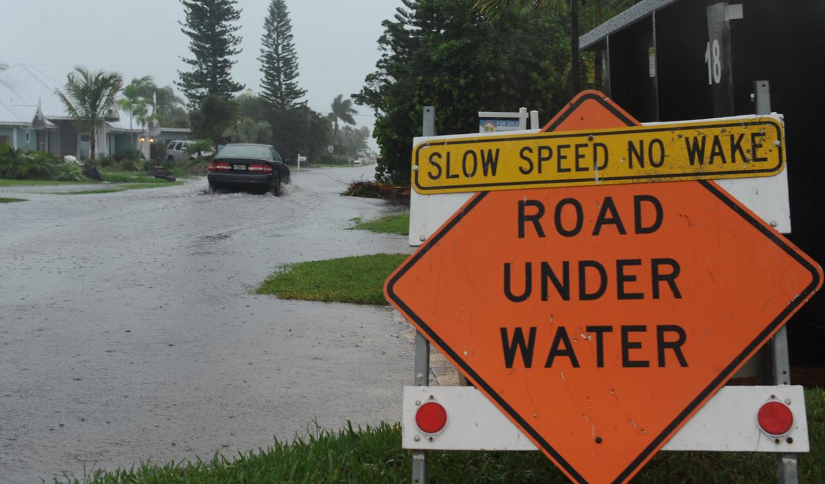 A car moves slowly through a flooded street in Holmes Beach as Tropical Storm Andrea moved over Anna Maria Island in 2018.