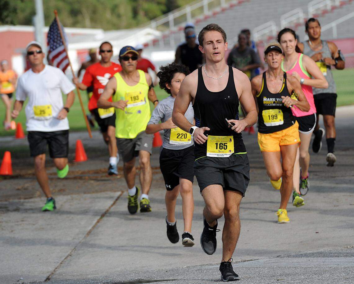 Runners leave the stadium at Manatee High for the 5K before the annual DeSoto Heritage Festival Parade.
