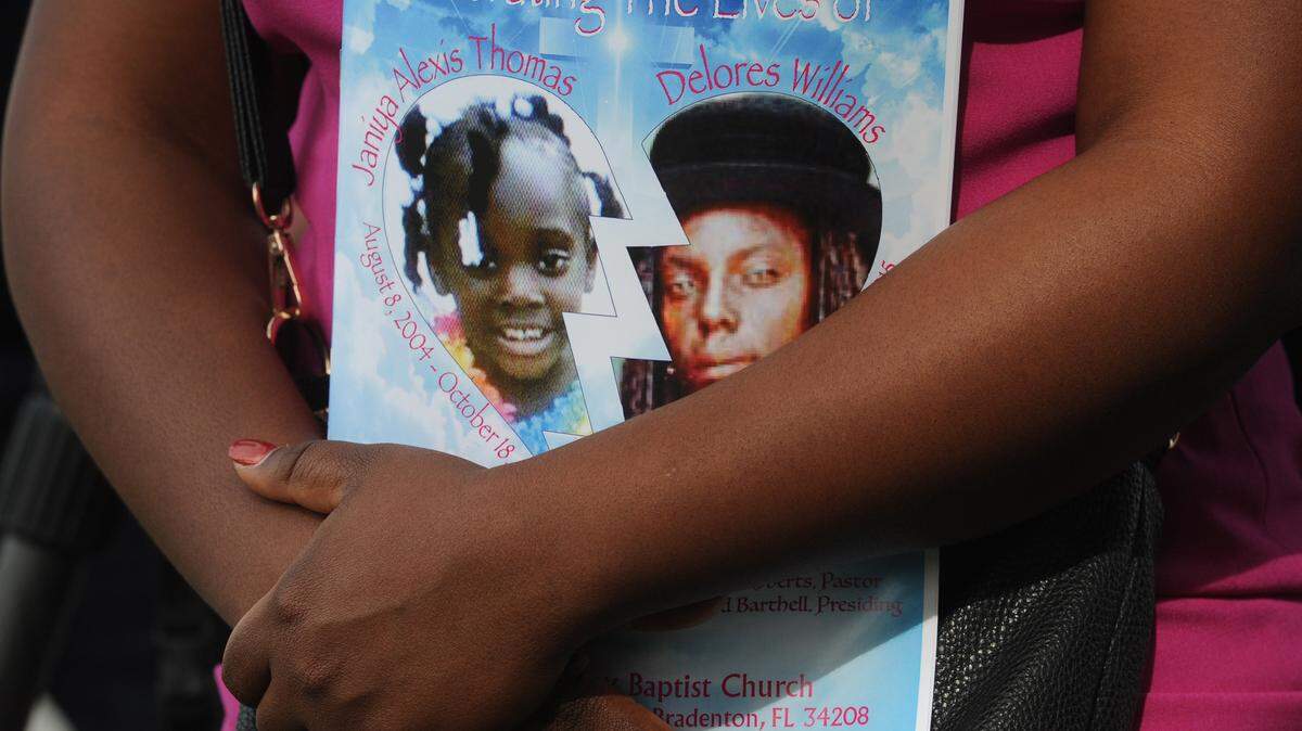 The pictures of Janiya Thomas, 11, and her grandmother, Delores Williams, 52, are displayed on a program at their funeral service at the St. Paul Missionary Baptist Church on Saturday. Janiya's body was found in a freezer in October after she was missing for almost a year. 
 GRANT JEFFERIES/Bradenton Herald