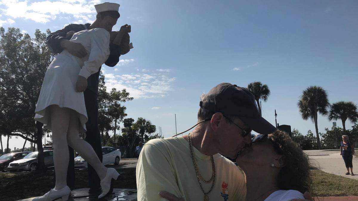 Several couples modeled the ‘Unconditional Surrender’ kiss on the Sarasota Bayfront on Tuesday, including Maureen and Cliff Camden.