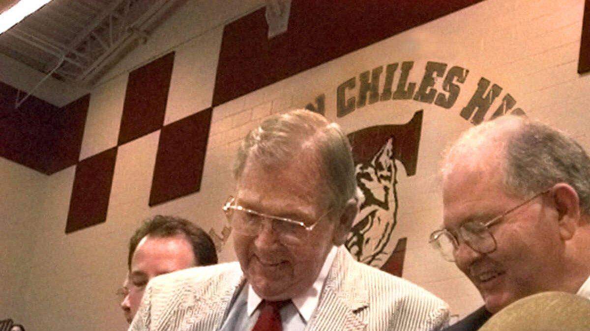Rhea Chiles, right, wife of deceased Gov. Lawton Chiles, officially dedicates the Lawton Chiles High School as she cuts the ribbon along with Leon County School Superintendent William Montford III, center, and Sen. Pat Thomas, left, D-Quincy, during ceremonies Thursday, Aug. 12, 1999, in Tallahassee. (AP Photo/Mark Foley)