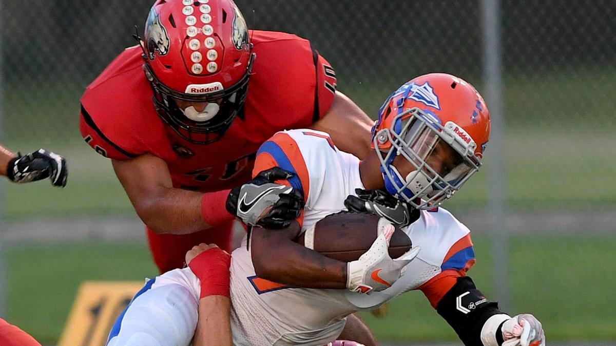 Southeast’s Chauncey Wilson is taken down by Cardinal Mooney’s defense during Friday night’s game between Southeast High at Cardinal Mooney in Sarasota.
