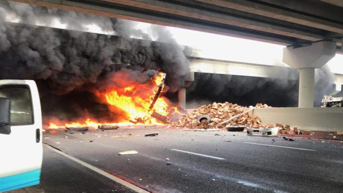 One person is dead after the driver of a tractor trailer carrying produce lost control, went through the guard rail and landed onto of at least one vehicle on Fowler Avenue and killing the person inside.