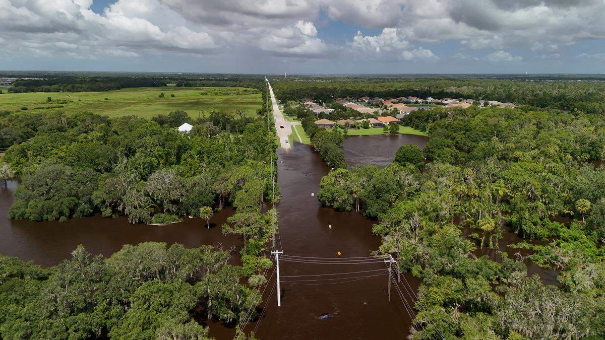 Rain and water from a release at the Lake Manatee dam flooded roadways in its path, including portions of Upper Manatee River Road.