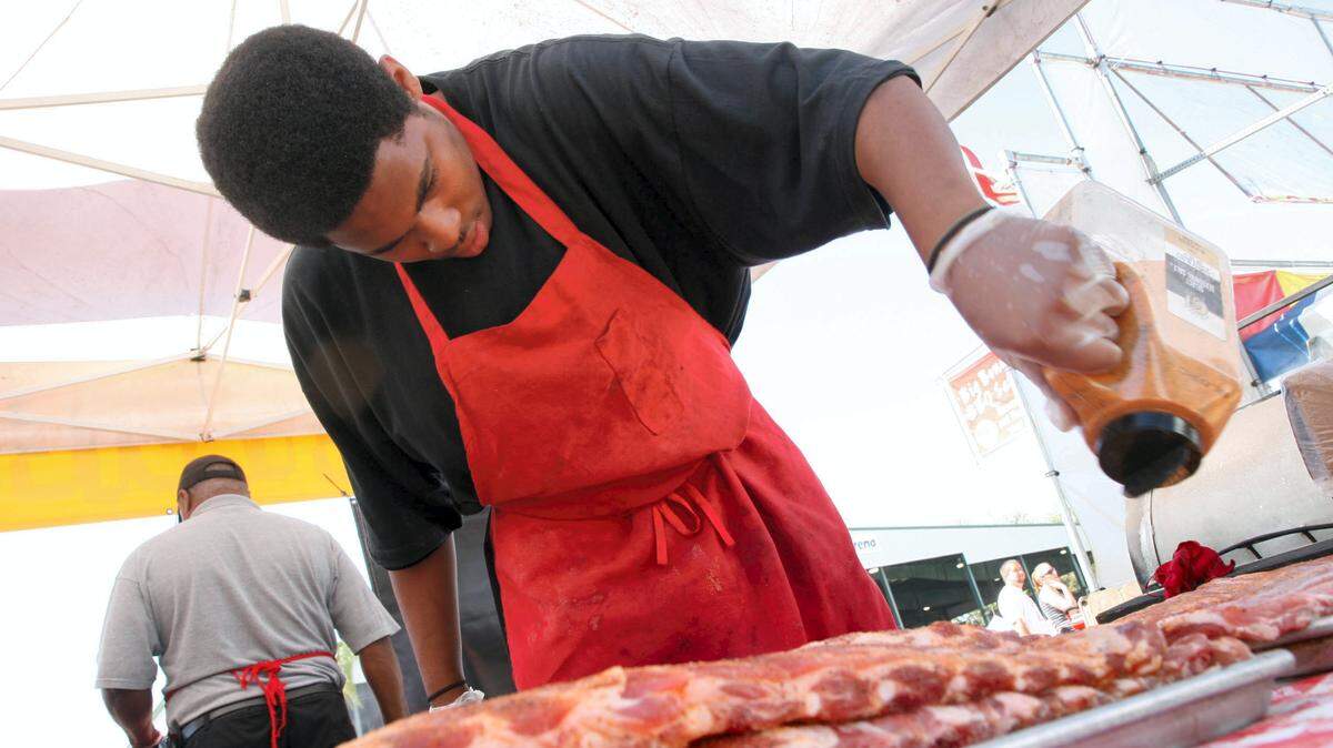 J & J Bar-B-Que bring their famous ribs to this weekend's Taste of Manatee at Sutton Park in Palmetto. HERALD FILE PHOTO