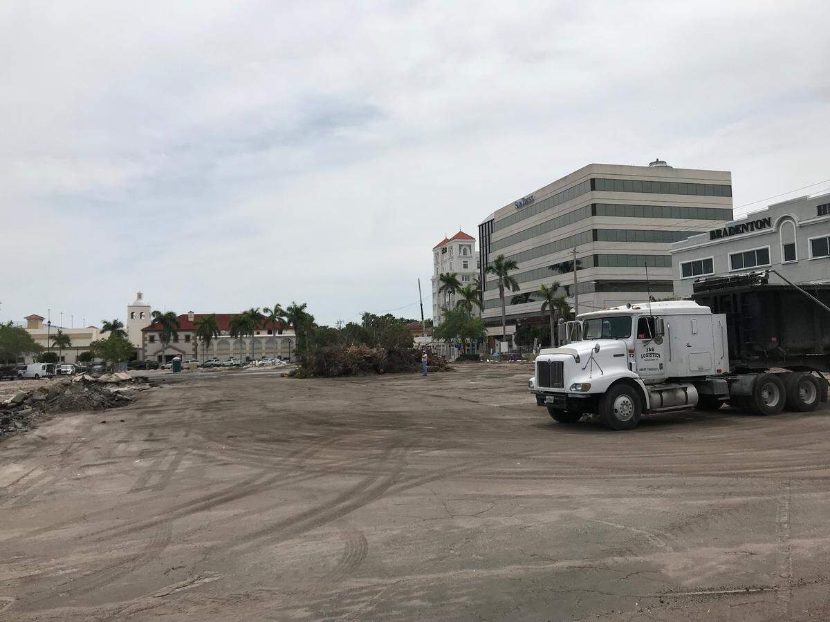 The Manatee Chamber of Commerce building has been demolished and the Bradenton City Hall parking lot torn up to allow construction of a parking garage that will also include commercial space and new chamber offices.