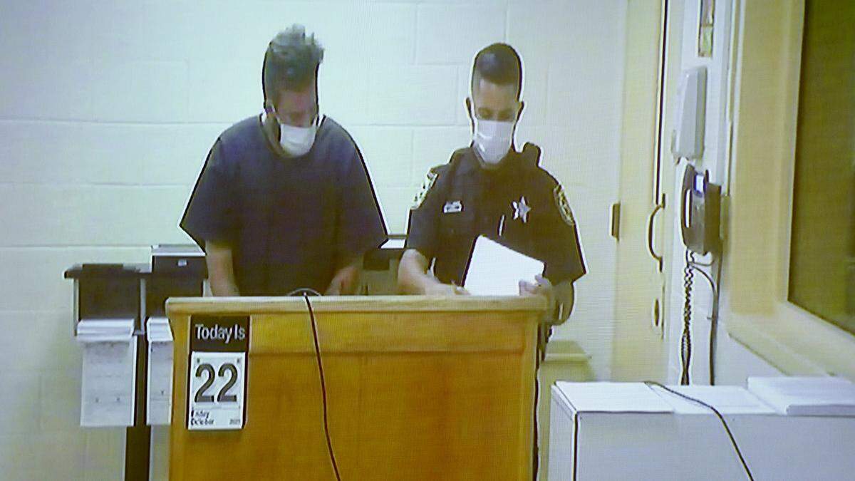 10/22/21—Blake Meadows, left, makes his first appearance before Judge Edward Nicholas via video feed from the Manatee County Jail in a charge of manslaughter in the shooting death of his wife. His bond was set at $70,000.